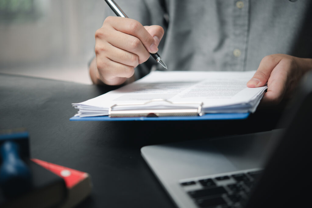 Checklist of Appendix A sponsor licence documents with organised files and folders on a desk, representing preparation for UK sponsor licence applications in 2025.