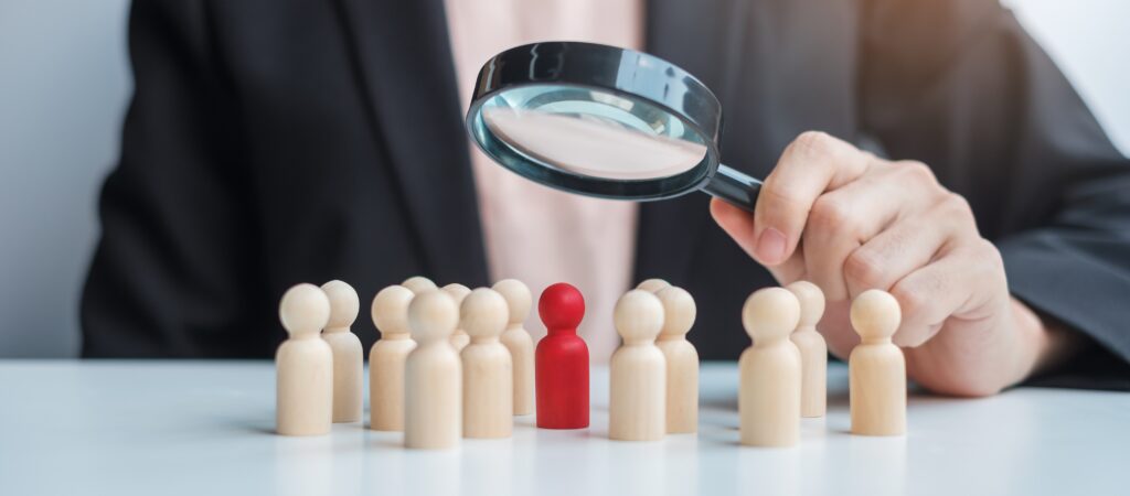 HR manager reviewing recruitment policies with overseas job applicants, symbolising ethical hiring and sponsor licence compliance in the UK.