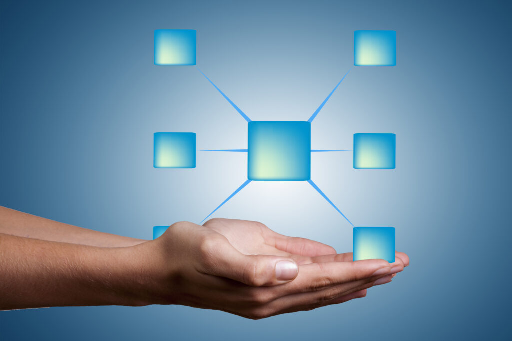 UK HR professional using a laptop with the Sponsor Management System open, managing Certificates of Sponsorship and monitoring compliance tasks.