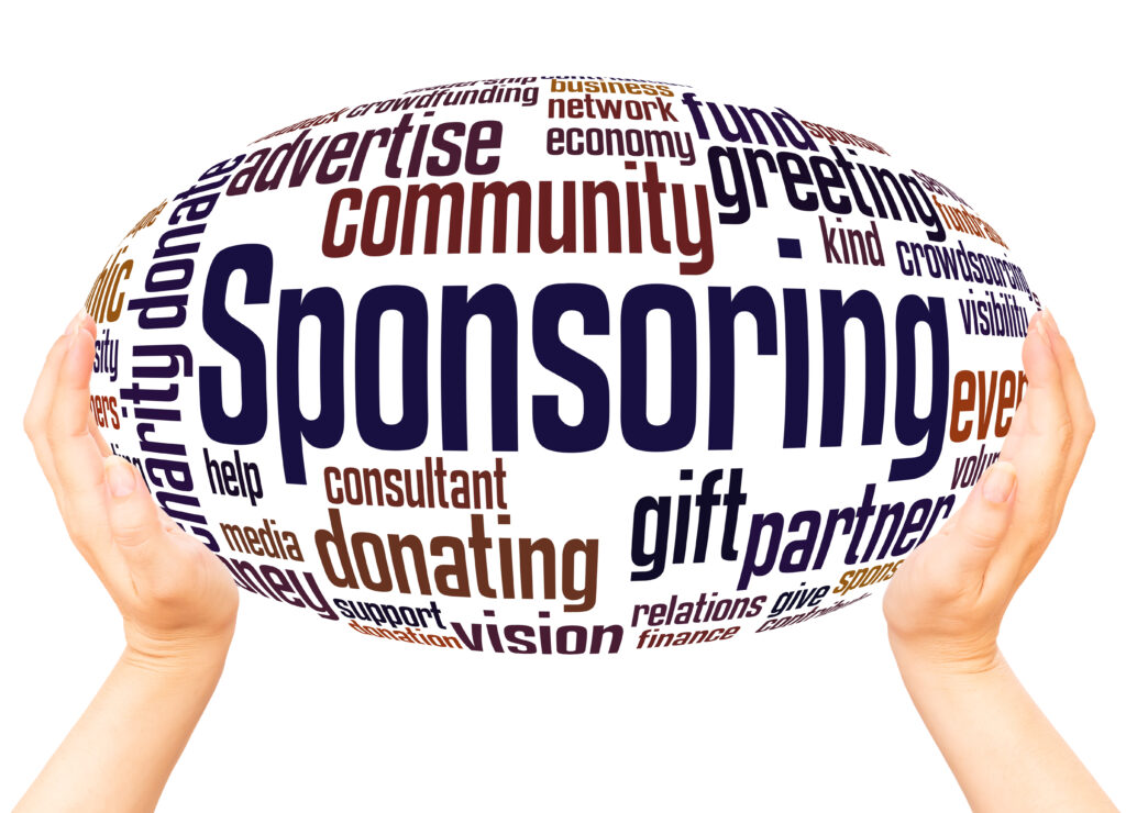 Business team reviewing sponsor licence documents with UK visa forms and laptop, symbolising the priority service process.